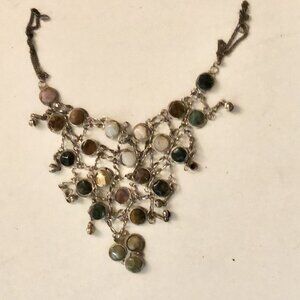 A multistone bib necklace with various stones in silver settings unbranded